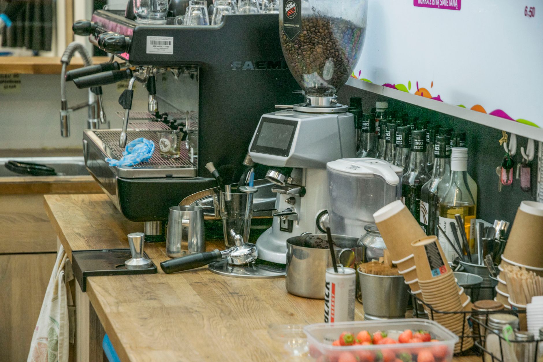 The crowded counter of a Neapolitan bar with baristas pulling espresso shots
